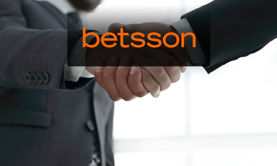 Dos hombres dándose la mano y logo de Betsson.