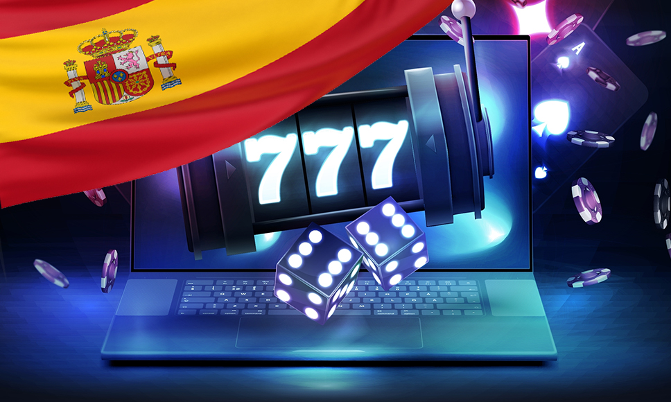 Juegos de casino y ordenador personal con la bandera de España.