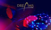 Logo del Grupo Dreams con fichas de casino.